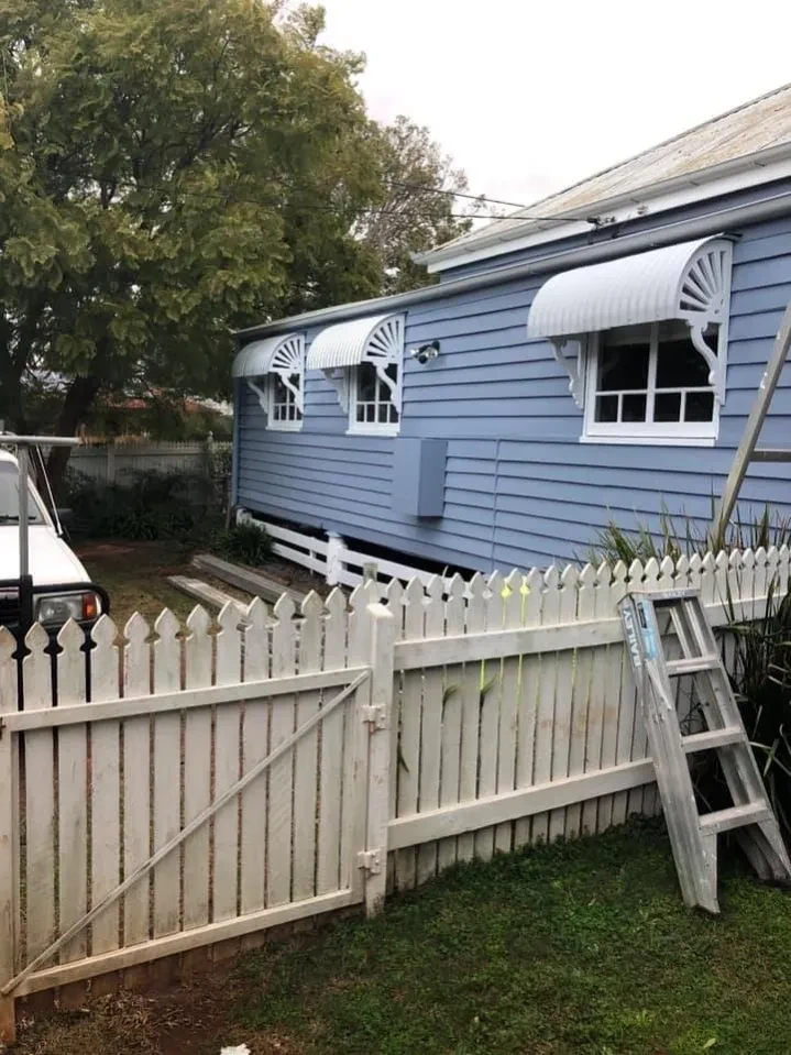 Mowed backyard with timber fence and shed